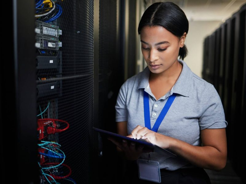 woman-tablet-and-server-room-programming-or-coding-for-cybersecurity-information-technology-or-d-e1746105217411.jpg